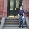 Larry stands on the steps of his 1962-63 apartment building in Boston