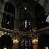 The great chandelier in Aachen's Cathedral, 13 feet 9 inches in diameter, is suspended from the - ceiling by an 88 foot long chain.  The chandelier has 16 turrets to symbolize Holy Jerusalem.