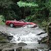 Near Haena State Park cars have to ford a stream flowing across the road.