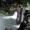 The swimming hole and waterfall. The locals were jumping off the cliff - and then swimming over to the ladder you can see there, to climb back out.