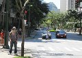 Sunday, April 19 -- Bill is standing near the east end of Kuhio Street where you can see Diamond Head - in the distance.  The lei was given to Bill by a woman at the restaurant where we had breakfast.