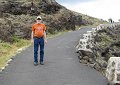 The trail climbed along the back side of the hill through lava rock.