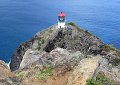 The lighthouse is located on a rocky point, as you can see here from the top of the hill.