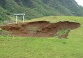 This hole used to be much deeper.  It was the hole made by Godzilla's foot. - They had to fill it in some, though, because cows kept falling into it.