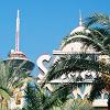 The Stratosphere Tower through the palm trees - by the Sahara.  Yes, that's a rollercoaster up there!