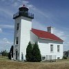 On the third morning of our road trip - we came to this lighthouse in Escanaba. - The plywood lady is a replica of the lady - who lived in the lighthouse in the late 1800s.