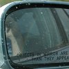 The rainbow was so bright we could see its reflection - off the car window in the car mirror.