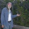 Bill with a very old tree. - It's not much taller than he is.