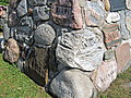 June 28: Near Kewadin, Michigan we found this stone marker.  It has stones from every county in Michigan.