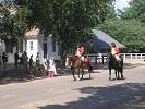 A small parade comes down Duke of Gloucester Street