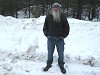 Bill and a small snowman someone built beside the road.