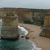 Close up view showing one of the Apostles and the colorful sandstone cliff