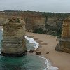 Close up view showing one of the Apostles and the colorful sandstone cliff