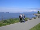 Tuesday morning Norman, Bill and Larry take a walk in Stanley Park. - Here you see Norman and Bill standing along the shore of English Bay.