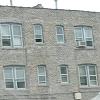 The three windows on the top floor left are the location of - Bill and Larry's first apartment together at 3406 West Foster Avenue.