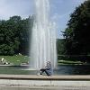 We pause by a fountain in the city park