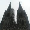 The twin towers of the cathedral.  We'll soon be climbing - up the right one.  Note the scaffolding on the left tower. - Just about every cathedral we saw was undergoing repairs.