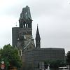 The Kaiser Wilhelm Memorial Church with the war-damaged tower. - It was left standing as a reminder of the horrors of war.
