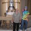 Louis and Bill on the first landing with a view of the first floor and the museum entrance behind them.