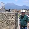 Mt. Vesuvius can be seen looming over the old ruins.