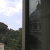 A reflection of Saint Peter's Basilica in one of the open windows of the museum.