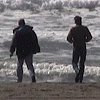 Robert and Larry frolicking in the surf