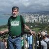 Larry at the top of the crater with Waikiki behind him.