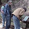 John S., Bill, and Larry read an interpretive plaque.