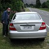 Bill next to our Camry rental car. The steering wheel - was on the right and we drove on the left like in Australia.