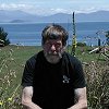 Larry with Lake Taupo and the Hauhungaroa Range behind him