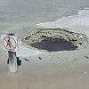We wondered whether the sign was put there - before or after the hole