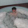 All of the Rotorua hotels had hot tubs. - Here Larry enjoys a soak.