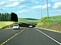 We rise up into the hills and find lush green fields along U.S. Route 12.