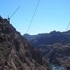 The cranes up high are starting on a bypass bridge to take the highway off the dam's top.