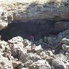 Chuck climbs through the lava tubes from the Dandera volcano.