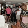 Sue, Bill, Ed, and in Ed's arms Smokey (their cat) - in their 40-foot motor home