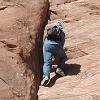 I could have climbed to the top of the arch using this line of hand-holes. - I decided not to because it might have irritated my bad toe joint. - I did not want to be hobbling around Moab for the next week instead of hiking! - So I turned around at the point you see me.